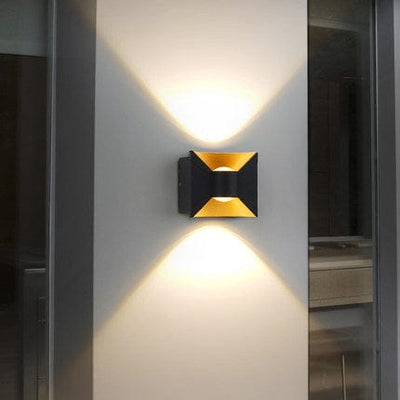 Black and yellow wall light placed outside the house