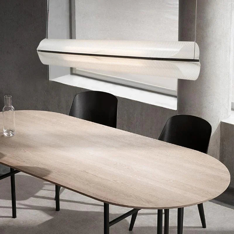 White linear pendant light placed above the dining table