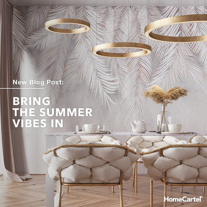 A modern dining room with gold and white chairs with title “Bring the Summer Vibes In”