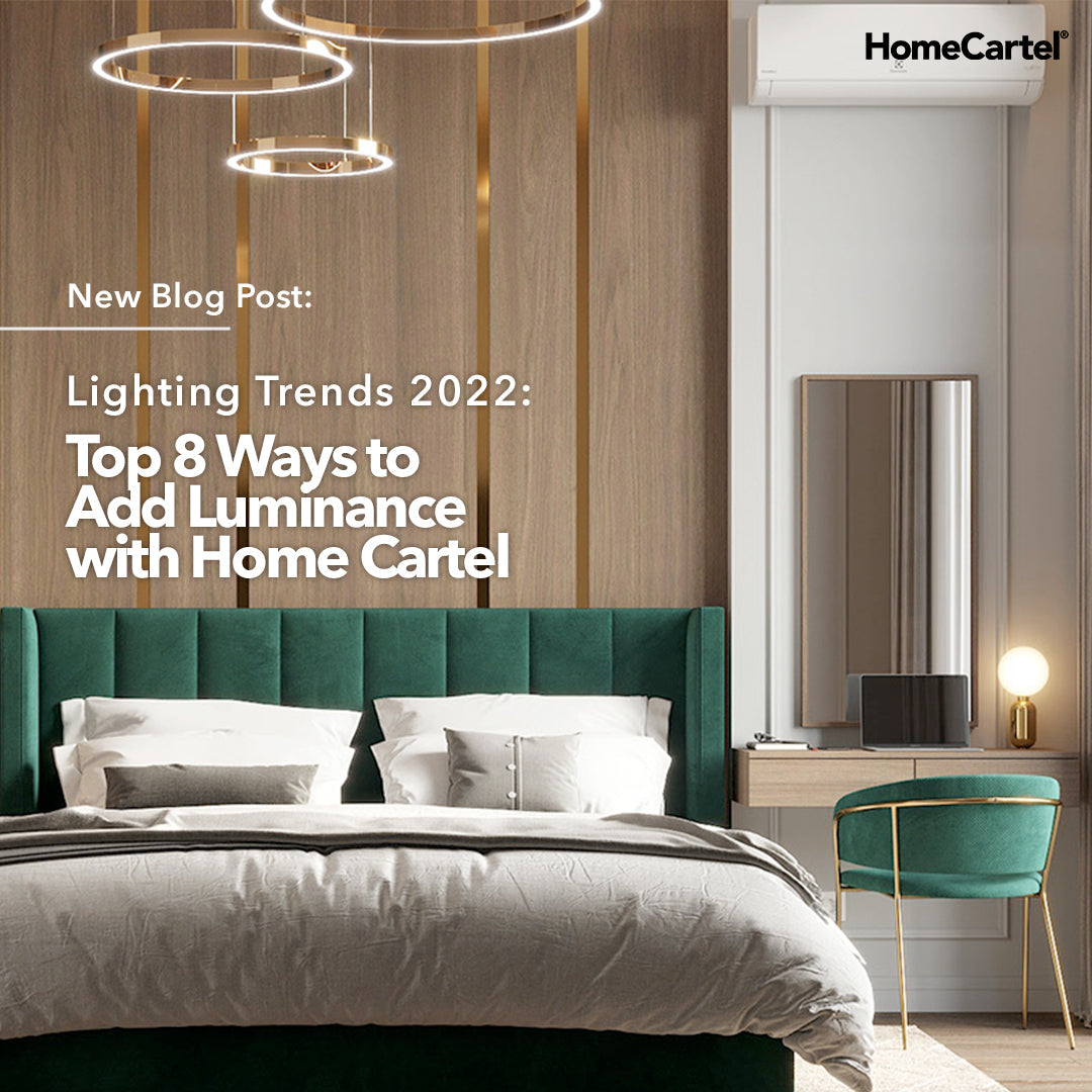 A bedroom with green bedframe and chair with a gold chandelier above