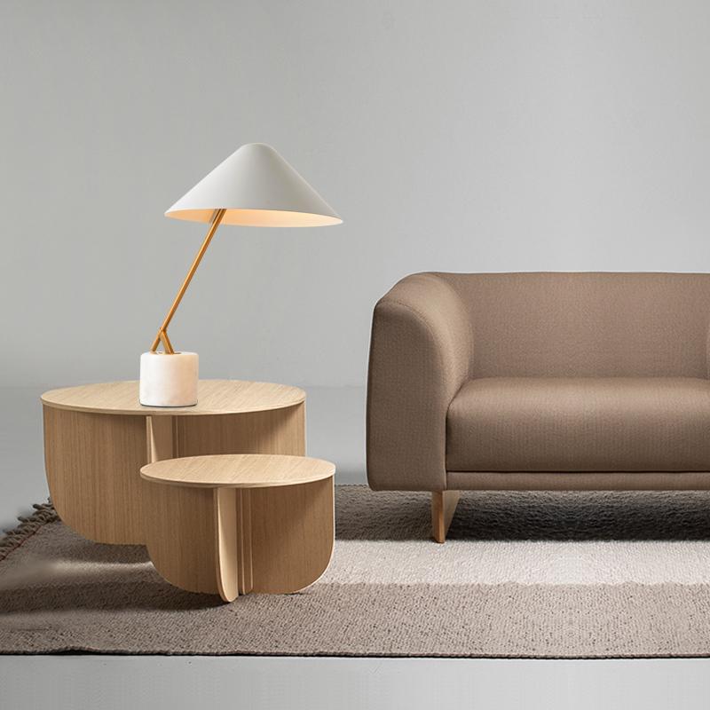 A minimalistic living area with a table lamp