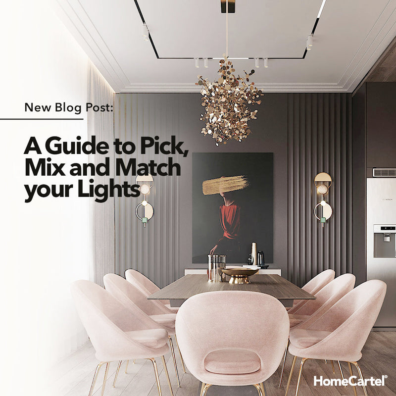 A dining area with pink chairs and artistic chandelier