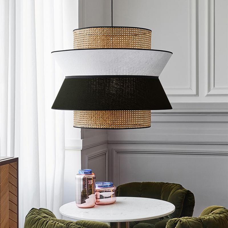 A round rattan ceiling-mounted chandelier with black accents