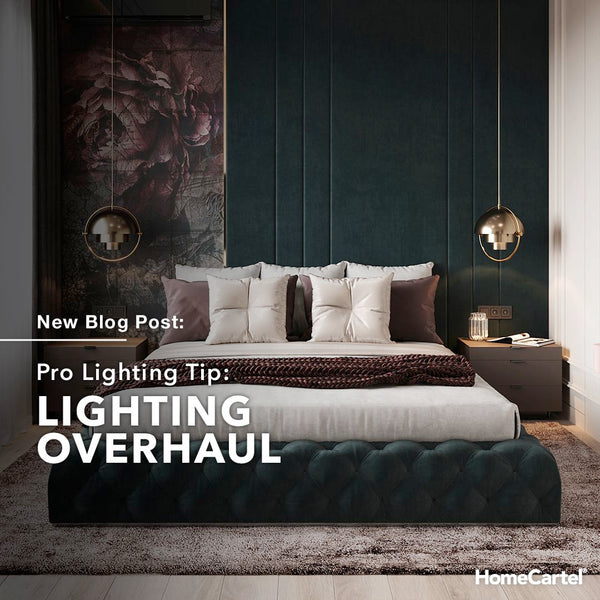 A modern bedroom with pendant lights hanging above both bedside tables